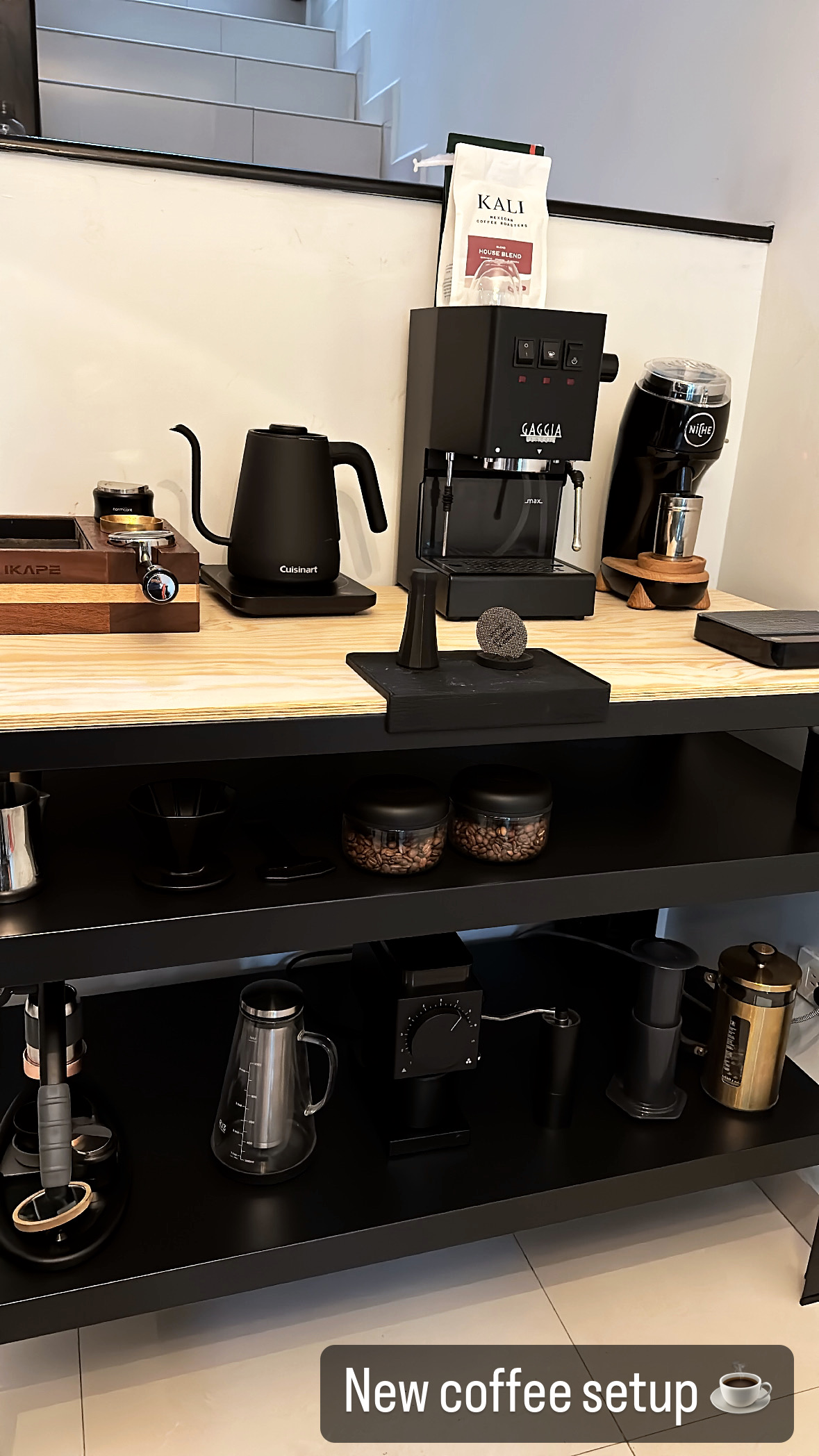 My coffee station with an espresso machine, grinder, and kettle